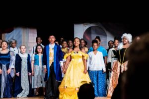 Students performing in Beauty and the Beast
