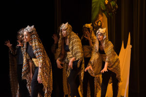 students performing in the Lion King