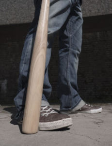 pair of legs and a baseball bat