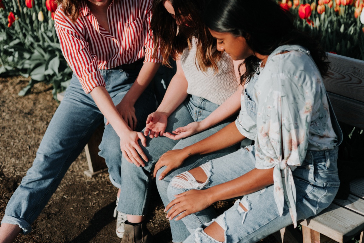 three young girls supporting eaching