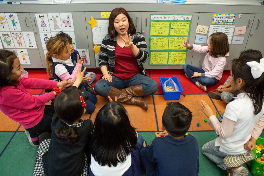 classroom full of students sitting in a circle