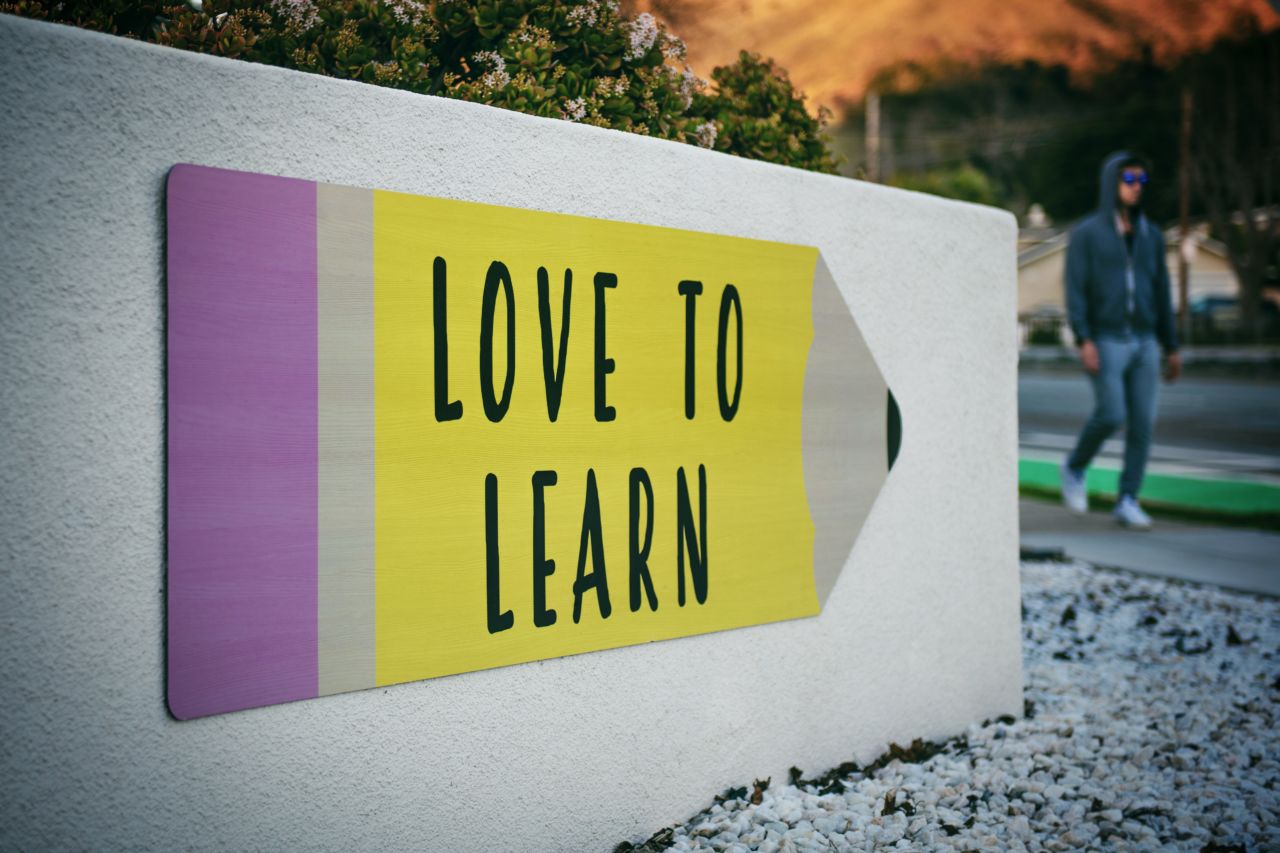 Love to Learn Sign in front of a school