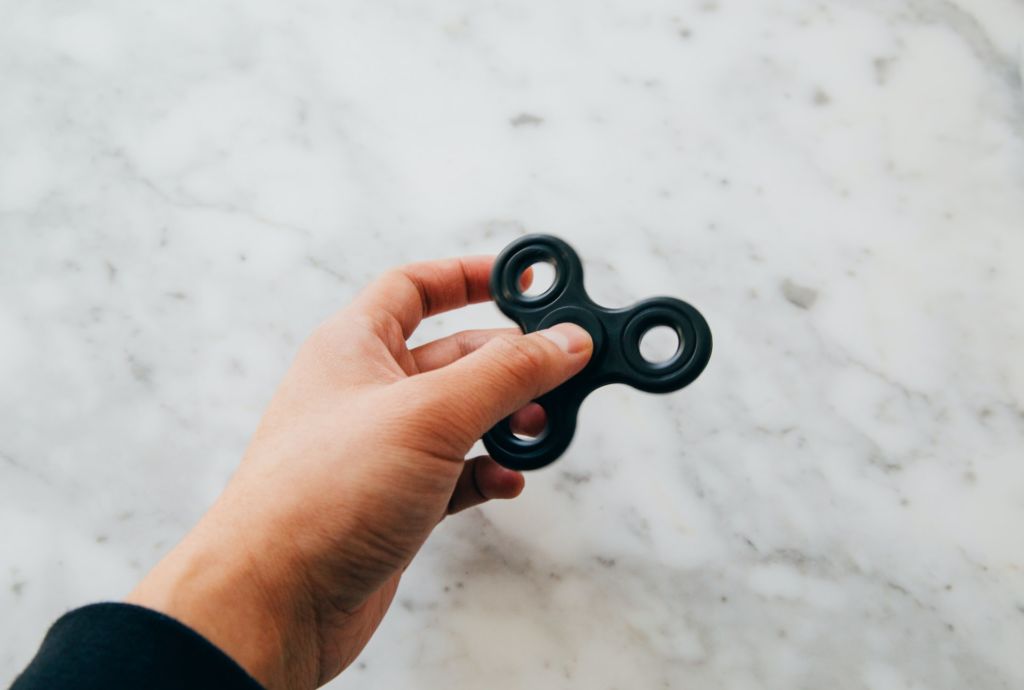 hand holding a fidget spinner