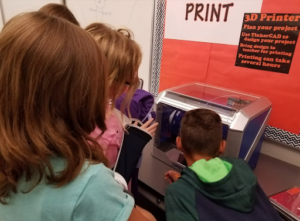 Students watching a 3D Printer